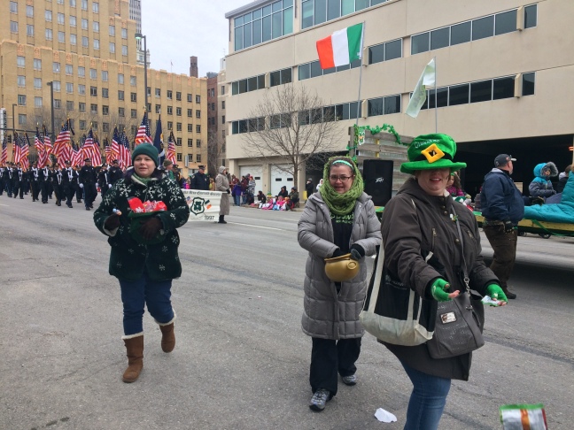 Bundled up for a cold celebration, marchers pass out candy at the St. Patrick's Day parade on March 11. VANESSA CHAVEZ/EXPLORING